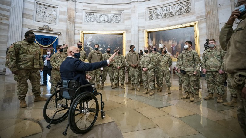 Republican Senator Brian Mast meets National Guard troops.