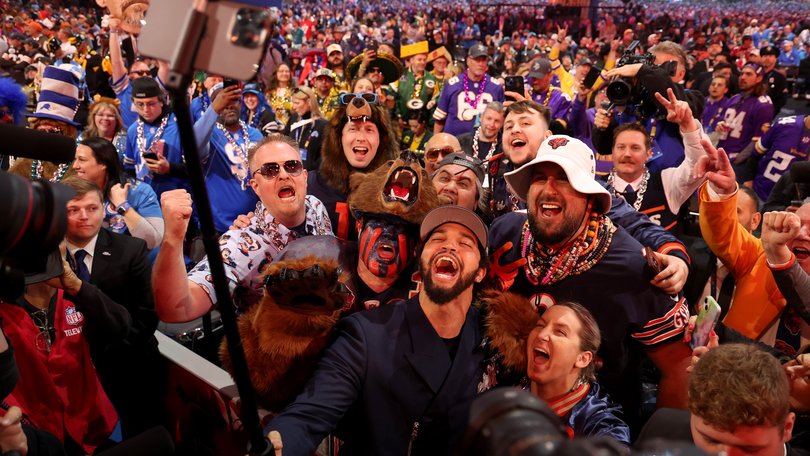 Caleb Williams celebrates with fans after being selected first overall by the Chicago Bears in 2024. 