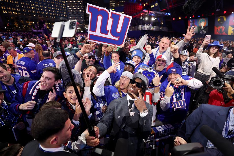 Malik Nabers celebrates with fans after being selected sixth overall by the New York Giants during the first round of the 2024 NFL Draft