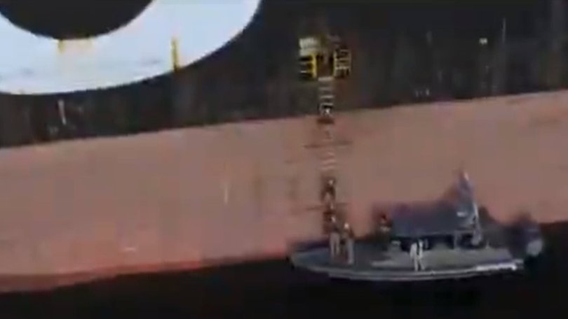 Stills from video posted to X of the seizure of a container ships in the Strait of Hormuz by IRGC Navy fighters.