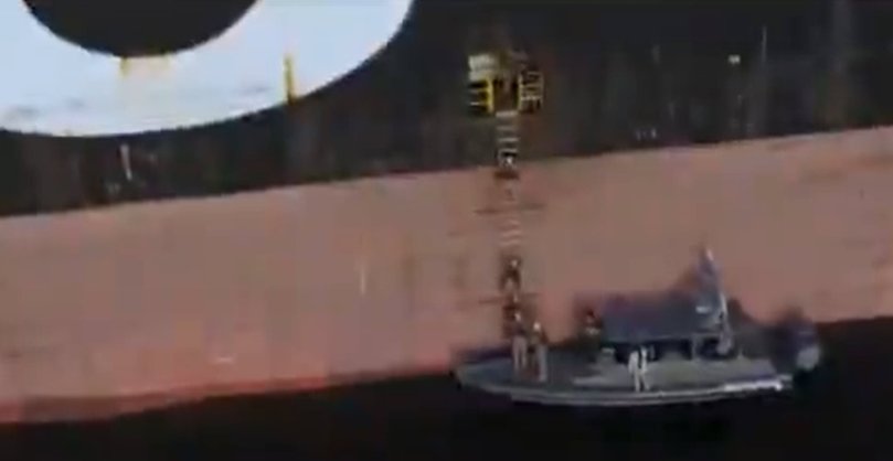 Stills from video posted to X of the seizure of a container ships in the Strait of Hormuz by IRGC Navy fighters.