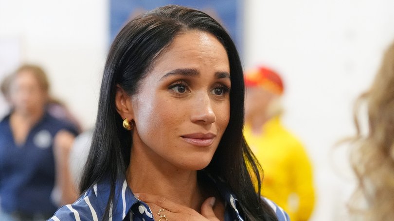 Meghan Markle meets volunteer first responders from the Bondi Surf Bathers' Life Saving Club during a visit to Bondi Beach. 