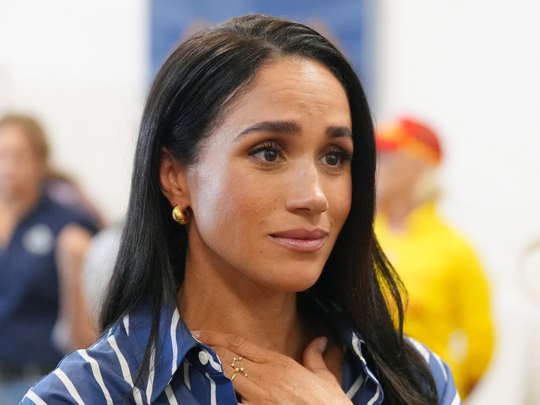 Meghan Markle meets volunteer first responders from the Bondi Surf Bathers' Life Saving Club during a visit to Bondi Beach. 