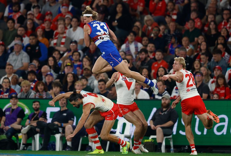 Aaron Naughton of the Bulldogs takes a spectacular mark.