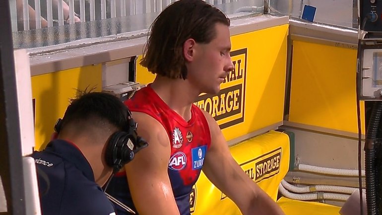 Jai Culley sits on the bench after going down with a knee injury.