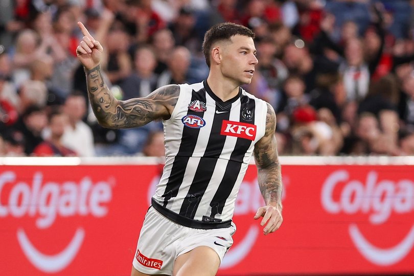Jamie Elliott of the Magpies celebrates a goal.
