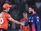 Sunrisers' Pat Cummins is welcomed back to the IPL by Rajasthan Royals captain Riyan Parag. (AP PHOTO)