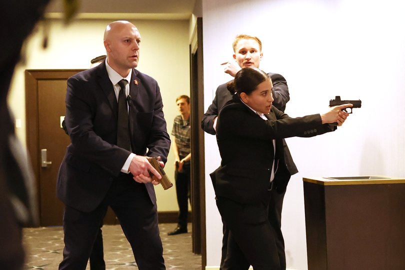 Secret Service agents respond during the White House Correspondents’ Dinner.