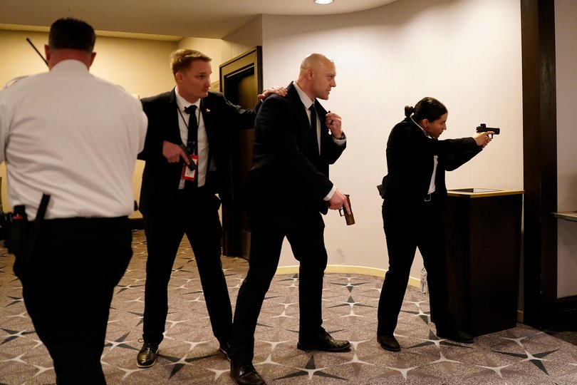 WASHINGTON, DC - APRIL 25: Federal agents draw their guns out after an incident at the annual White House Correspondents Association Dinner April 25, 2026 in Washington, DC. According to reports, President Donald Trump, along with other government officials, were evacuated from the Washington Hilton after what sounded like gun fire. (Photo by Nathan Howard/Getty Images) Picture: Nathan Howard