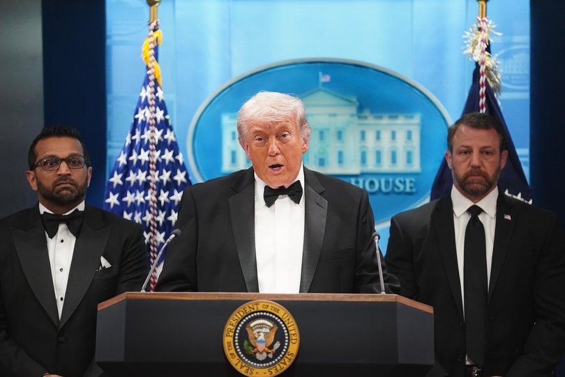WASHINGTON, DC - APRIL 25: U.S. President Donald Trump speaks during a press conference while flanked by FBI Director Kash Patel and Secretary of Homeland Security Markwayne Mullin in the Brady Briefing Room of the White House on April 25, 2026 in Washington, DC. President Trump is making a statement after the cancelation of the annual White House Correspondents Association Dinner after a possible shooting. (Photo by Nathan Howard/Getty Images) Picture: Nathan Howard