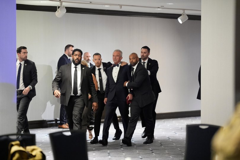 epa12914386 Health and Human Secretary Robert Kennedy Jr. is evacuated by law enforcement officers during the White House Correspondents’ Association Dinner at the Washington Hilton Hotel in Washington, DC, 25 April 2026. President Trump and First Lady Melania Trump were previously evacuated from the event after shots were fired inside the hotel. EPA/YURI GRIPAS / POOL Picture: YURI GRIPAS / POOL