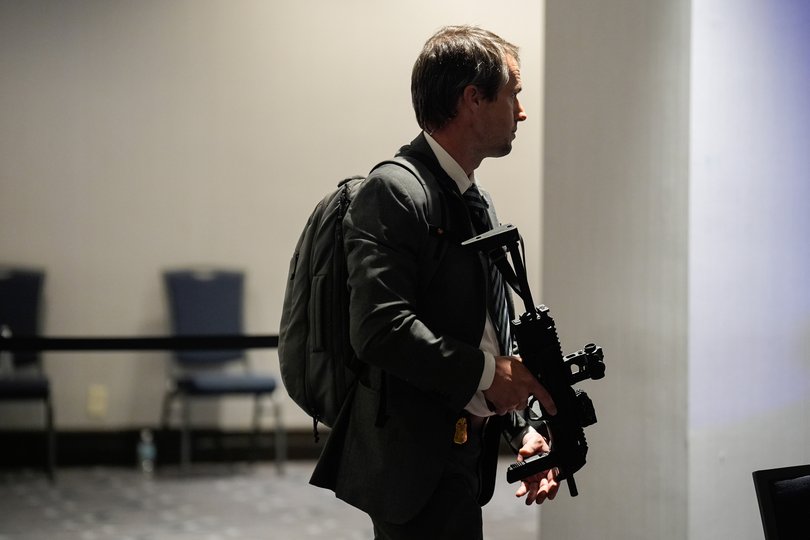 A law enforcement officer responds following reports of a shooting during the White House Correspondents' Association (WHCA) dinner.