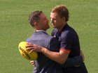 Jordan Dawson and Joel Selwood share an embrace before the Adelaide-Brisbane clash.