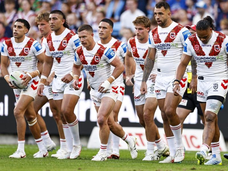 Dragons players take in the defeat.