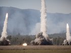 High Mobility Artillery Rocket Systems of the United States Army and United States Marine Corps launch rockets during a firepower demonstration held at Shoalwater Bay Training Area in Queensland, during Talisman Sabre 2021.