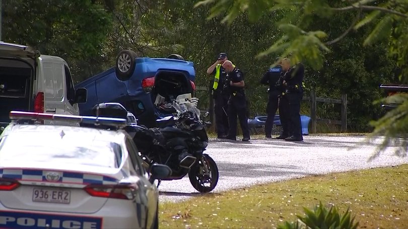 Emergency crews were called after a car flipped, killing a woman and injuring her dog.