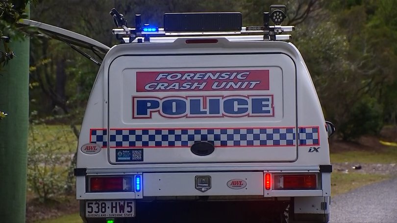 Forensic crash investigators are examining the scene after a deadly rollover claimed a woman’s life and injured her dog.
