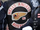 A Hells Angels bikie has been charged after allegedly impersonating a former ADF soldier. 