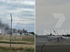 A huge inferno has erupted after a plane crashed into a hangar at Parafield Airport in Adelaide’s north. 