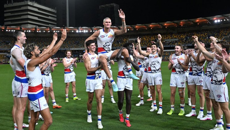 Lobb is chaired off after playing his 200th game earlier this year. 