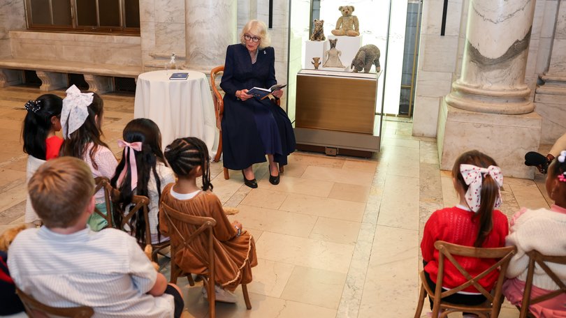 Queen Camilla reads Winnie-the-Pooh to children at the New York Public Library.