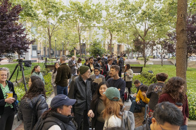 People wait to enter for Elon Musk’s trial against OpenAI.