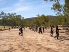 Alice Springs local volunteers join Police and emergency services to scour thick scrub and terrain surrounding the Todd River on day three of search for missing 5 year old Sharon Granites in Alice Springs, Tuesday, April 28, 2026. (AAP Image/Rhett Hammerton) NO ARCHIVING