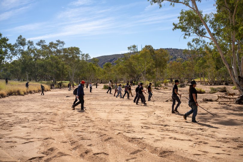 Alice Springs local volunteers join police and emergency services to scour thick scrub and terrain surrounding the Todd River on day three of search for missing 5 year old Kumanjayi Little Baby.