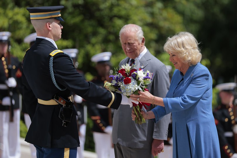 King Charles III and Queen Camilla present a bouquet of flowers at the Tomb of the Unknown Soldier during a ceremony at Arlington National Cemetery on the final day of the state visit. (Photo by Heather Diehl/Getty Images)