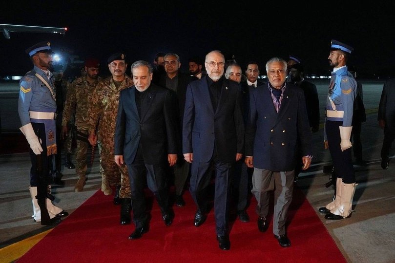 A handout photo made available by the Iranian Foreign Ministry shows Iranian Parliament Speaker Mohammad Bagher Ghalibaf (C) and Iranian Foreign Minister Abbas Araghchi (L) upon arrival at the airport in Islamabad, April 11.