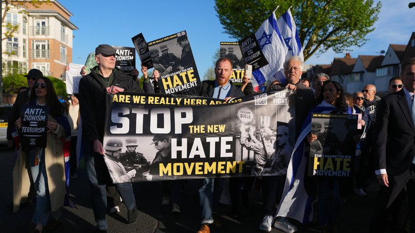 People participate in an Anti-Zionism, Stop the Hate protest in Golders Green following the stabbing of two people.