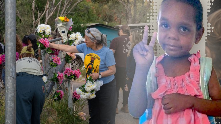 Alice Springs residents place flowers on the gates at the Old Timers Camp before joining a procession to the home of five-year-old Kumanjayi Little Baby.