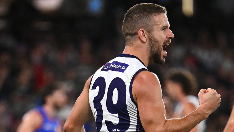 Sam Switkowski of the Dockers celebrates kicking a goal.