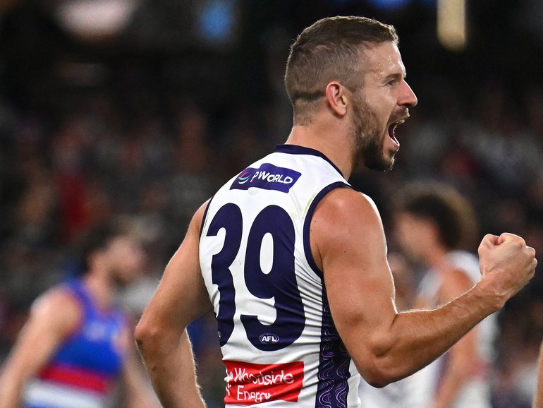 Sam Switkowski of the Dockers celebrates kicking a goal.