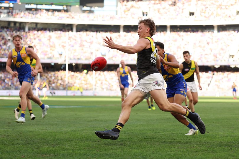 PERTH, AUSTRALIA - MAY 02: Kane McAuliffe of the Tigers kicks the ball during the round eight AFL match between West Coast Eagles and Richmond Tigers at Optus Stadium, on May 02, 2026, in Perth, Australia. (Photo by Janelle St Pierre/AFL Photos/via Getty Images)