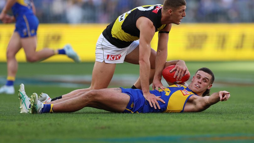 Jake Waterman of the Eagles marks the ball.