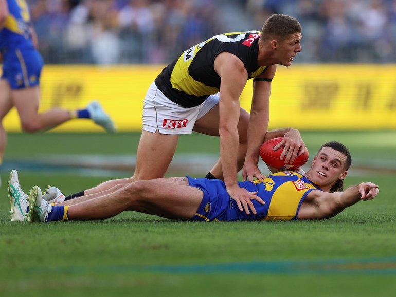 Jake Waterman of the Eagles marks the ball.