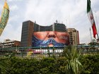 A giant banner depicting the Strait of Hormuz is displayed n Tehran, with the lips of Donald Trump.