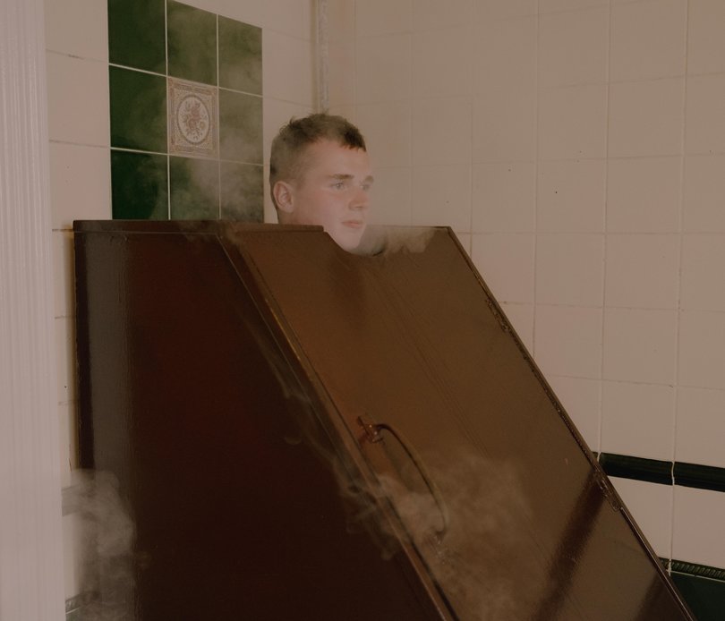 Frankie Higgins using a steambox before a seaweed bath. 