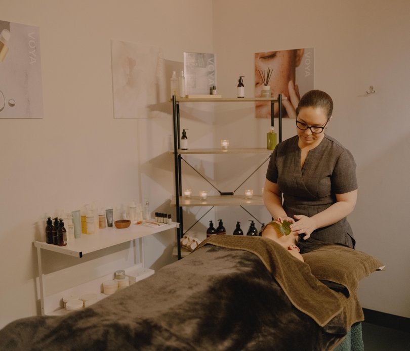Vanessa Boggins, a therapist manager at VOYA gives a facial treatment using seaweed wraps.