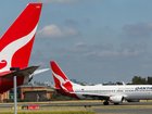 Qantas CEO told professional investors travellers would prefer to cut back on drinking or socialising rather than air travel.