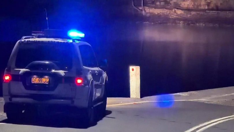 An urgent search is underway to rescue a young man who is believed to be trapped inside a car submerged in a weir in Sydney’s south on Wednesday morning. 