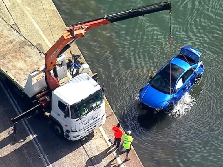 Emergency services have made a heartbreaking discovery in the search for a young man who became trapped inside a car after it ploughed into a weir. 
