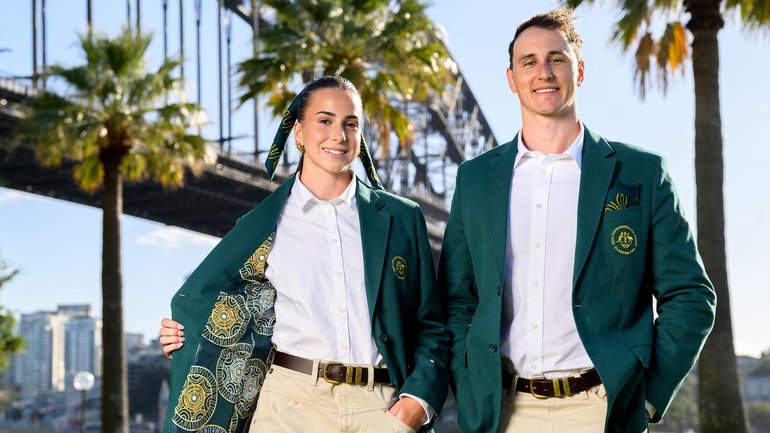 Athletes Delta Amidzovski and Cam McEvoy pose for a photograph wearing the Australian Team’s ceremonial uniform.