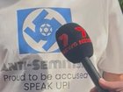 A man wearing a swastika on his shirt was moved on by police outside the royal commission on anti-Semitism. Clareese Packer/NewsWire.