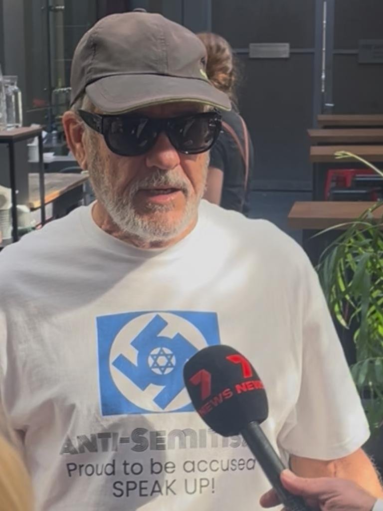 A man wearing a swastika on his shirt was moved on by police outside the royal commission on anti-Semitism. Picture: Clareese Packer/NewsWire.