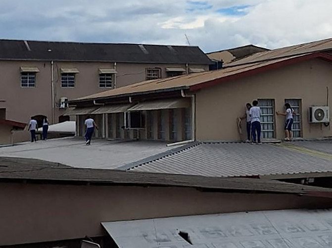 A teenager shot dead two staff members and injured two other people, including an 11-year-old girl, on Tuesday in the latest school shooting to rock Brazil.