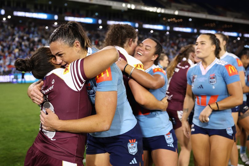 Destiny Brill of the Maroons congratulates Millie Elliott of the Blues last week.