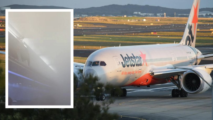 A passenger has described the 'horror movie' scenes onboard a flight from Bali as thick mist filled the cabin.