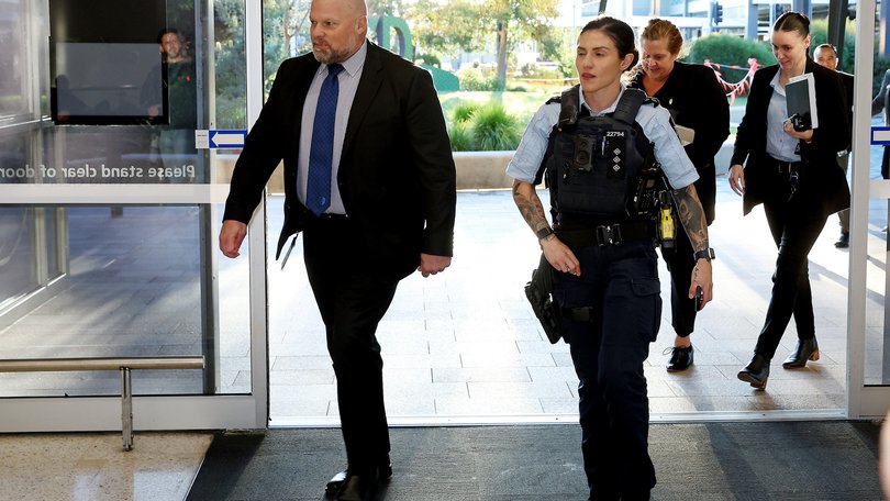 SYDNEY, AUSTRALIA - NewsWire Photos MAY 7  , 2026: AFP personell enter the Arrivals area at Sydney Airport.  ISIS Brides return to Australia. Isis Bride Janai Safar and her son will arrive at Sydney Airport. They were part of a group of 4 women and 9 children who are returning to Australia after years spent in a Syrian refugee camp. NewsWire / John Appleyard